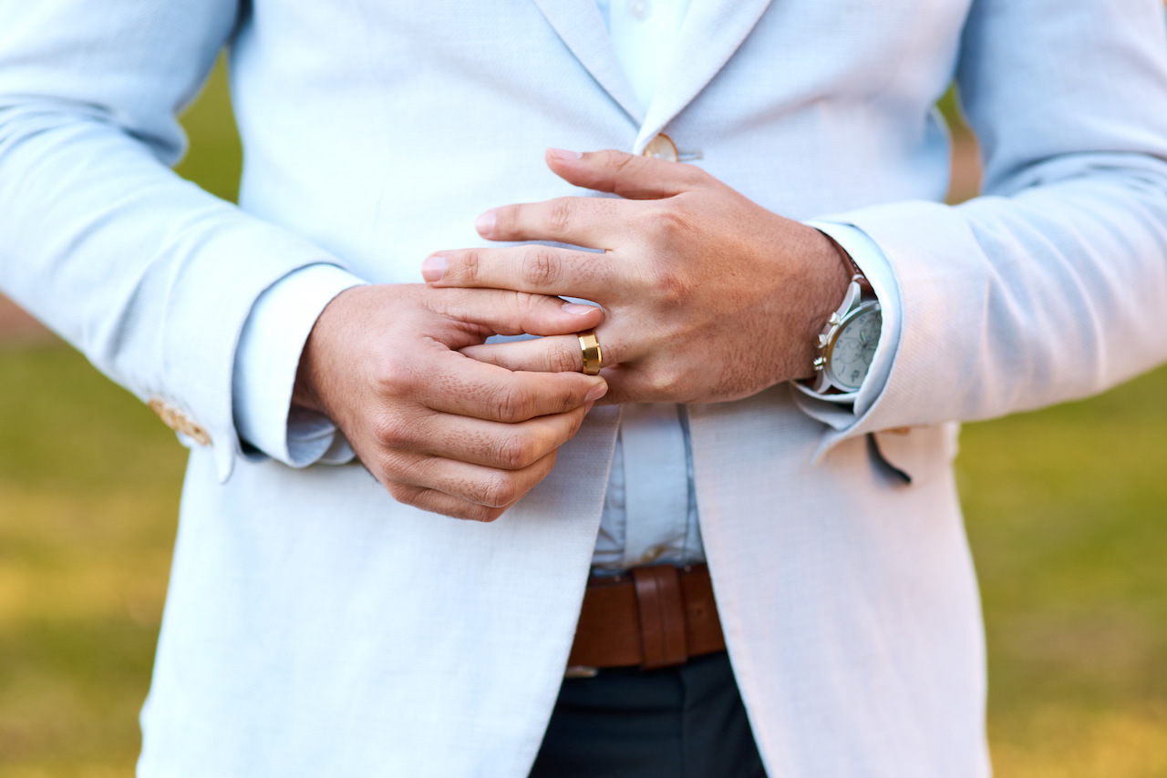 closeup of groom's wedding ring